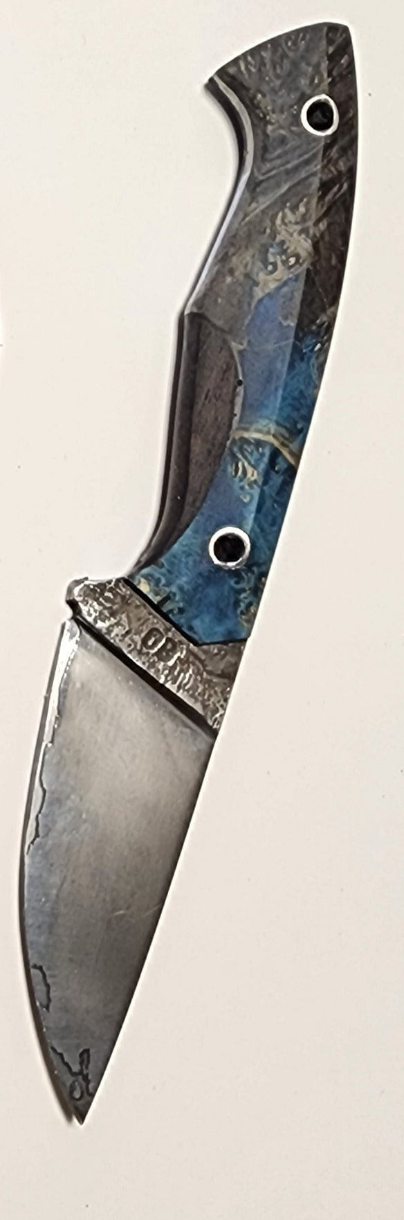 Knife with a decorative handle on a light background